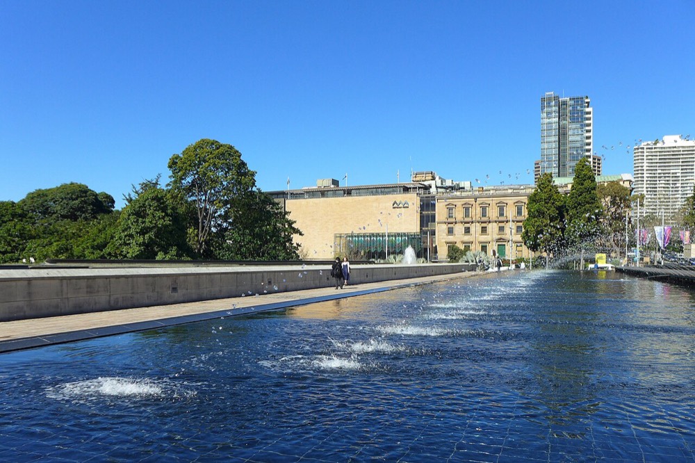 Fountains in Cook + Phillip Park on a blue-sky day